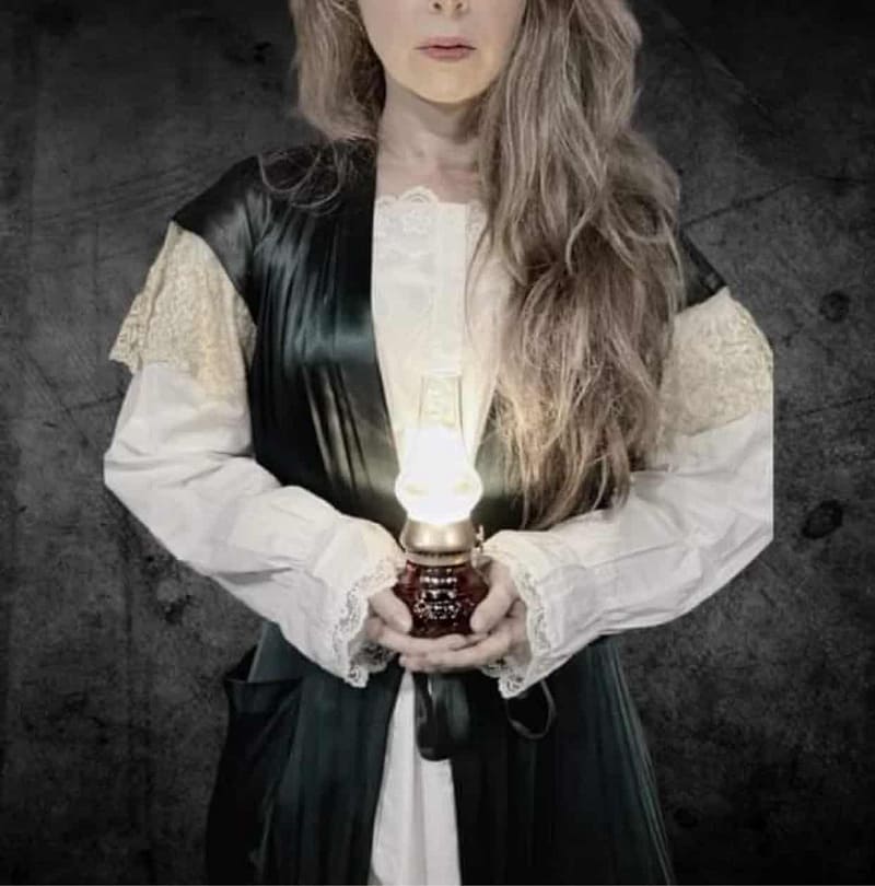 actress holding lantern